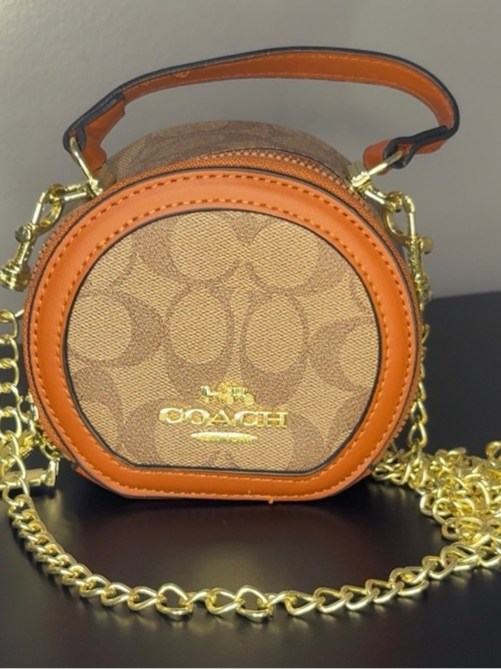 Coach Round Signature Crossbody in Brown and Orange Leather Trim